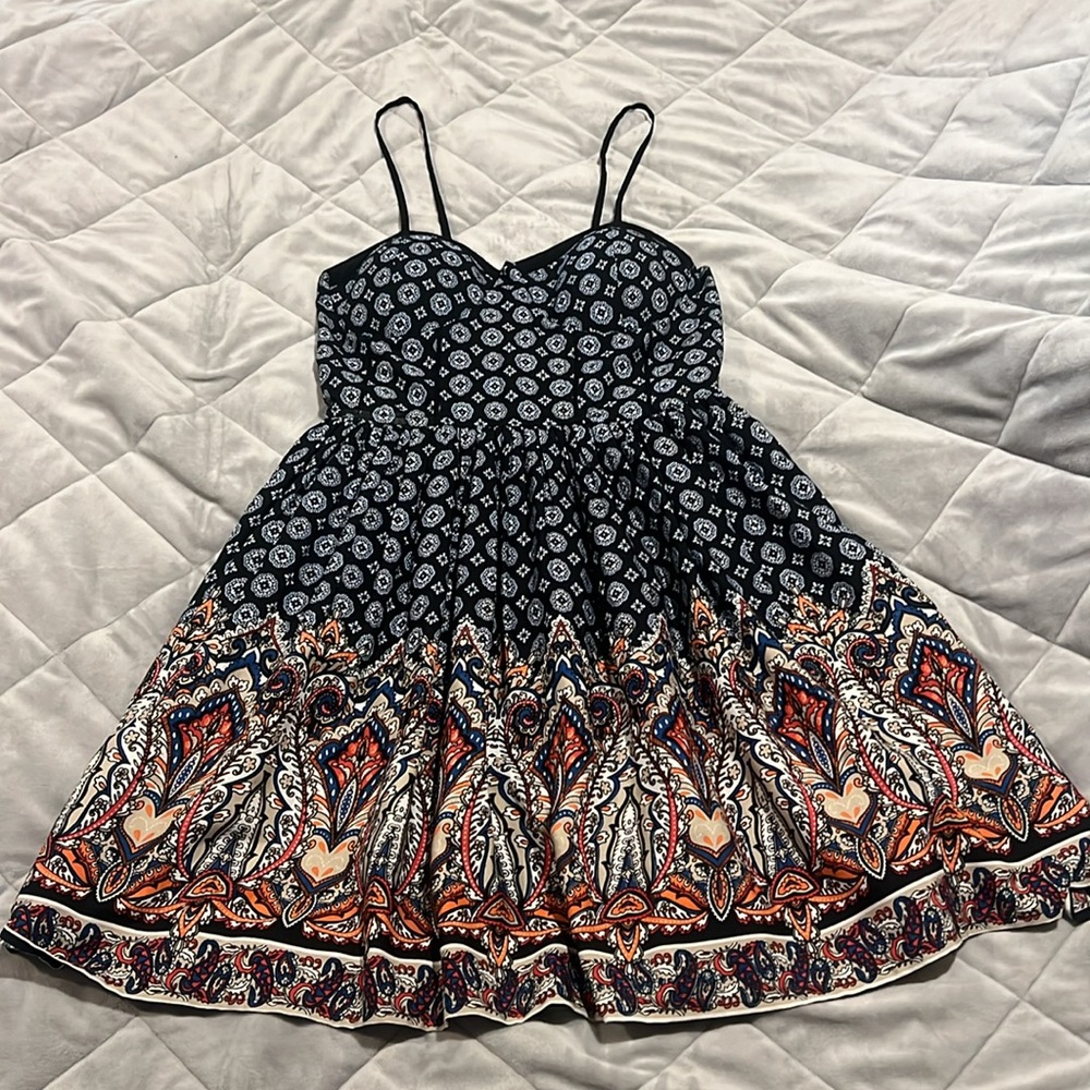 Multi color dress. Adjustable straps. Stretchy back. A-line skirt.